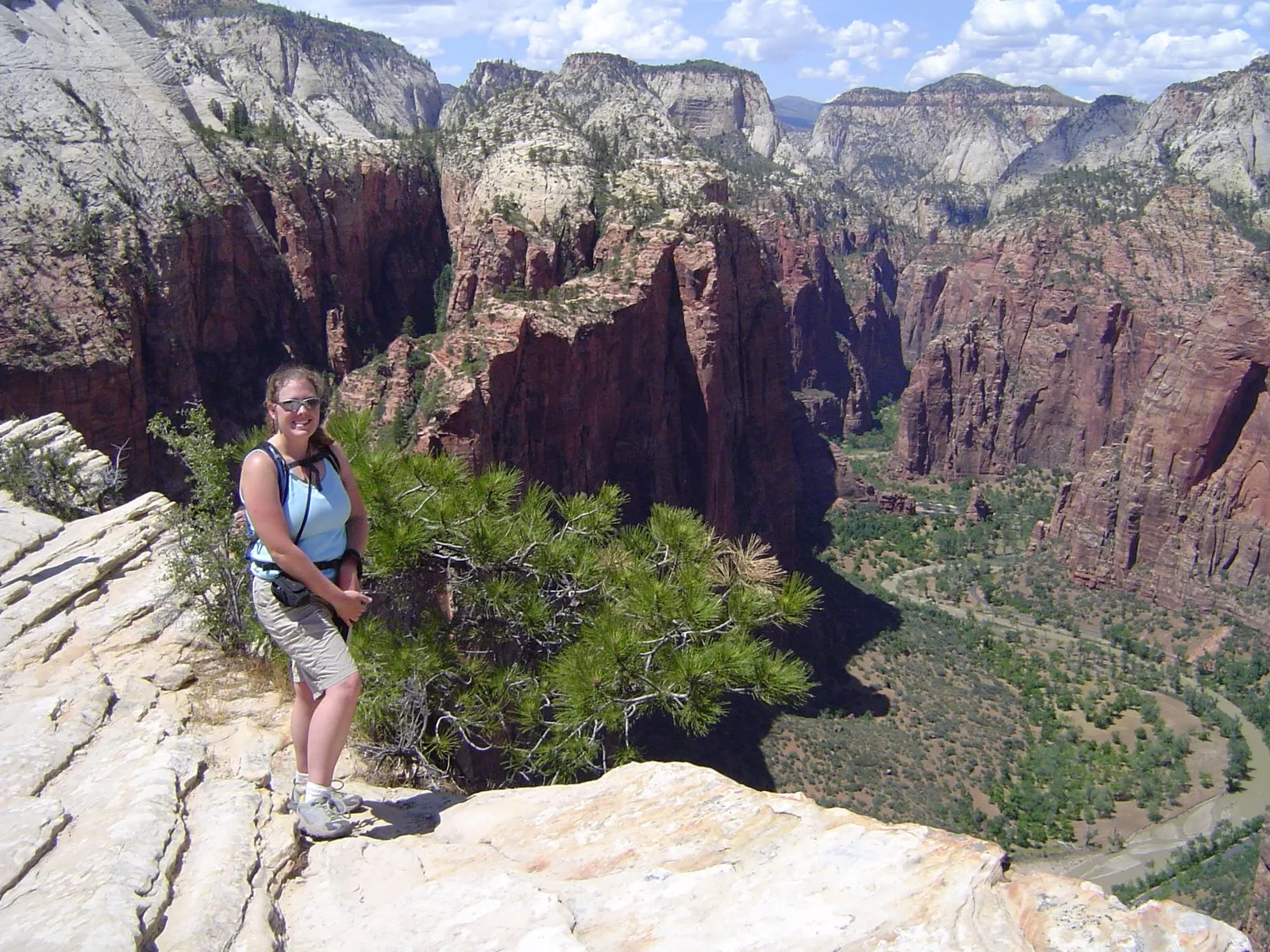Kate on a rock ledge at Angels Landing in Zion National Park