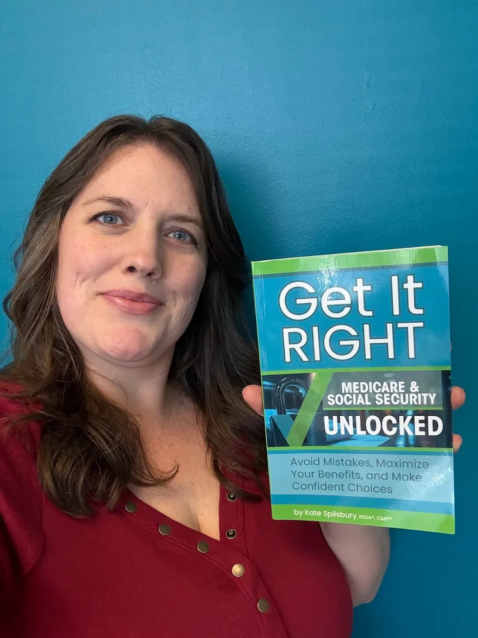Kate Spilsbury holding her book, Get It Right: Medicare & Social Security Unlocked