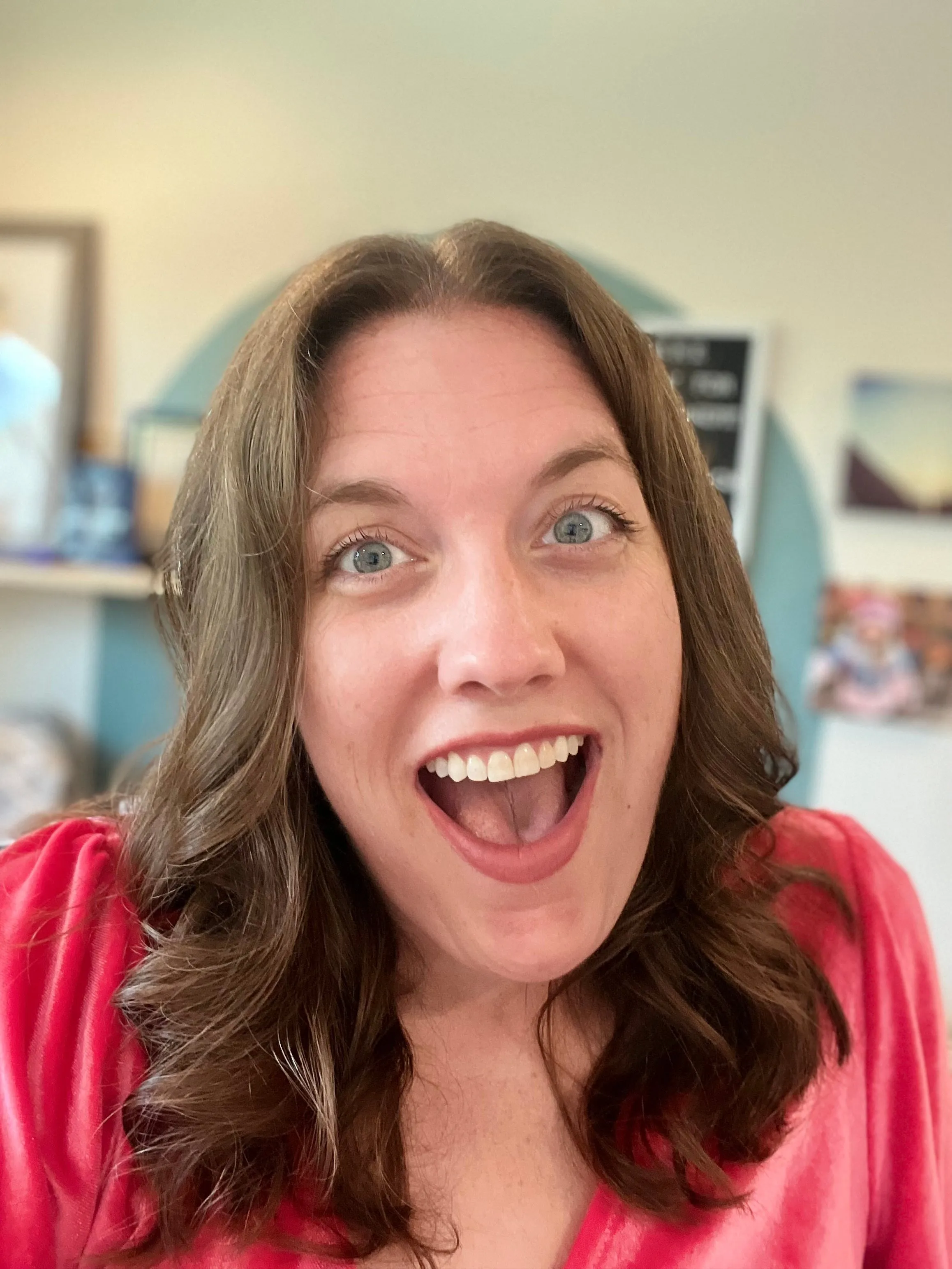 Kate Spilsbury smiling with an excited, open expression